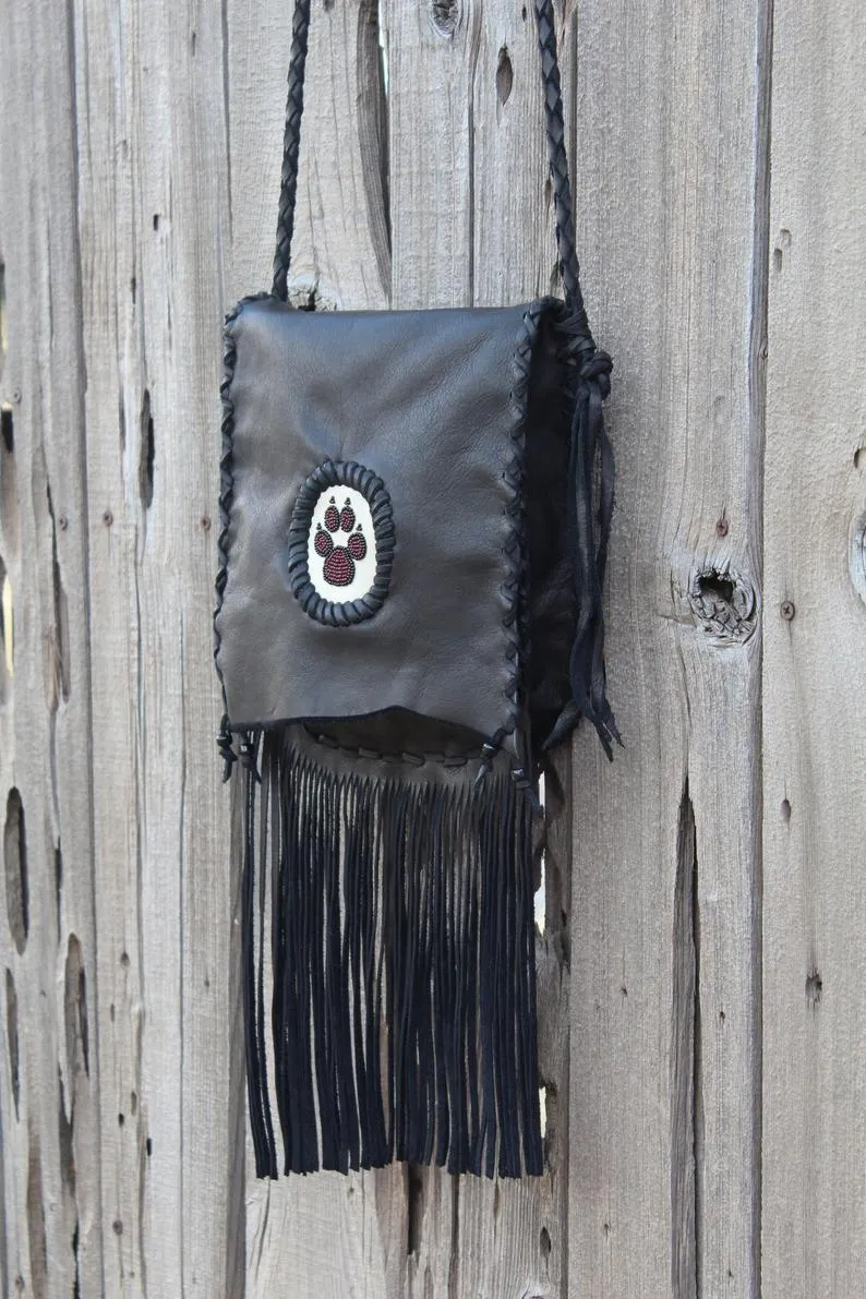 Stylish Black Fringed Handbag with Elegant Beaded Wolf Paw Design